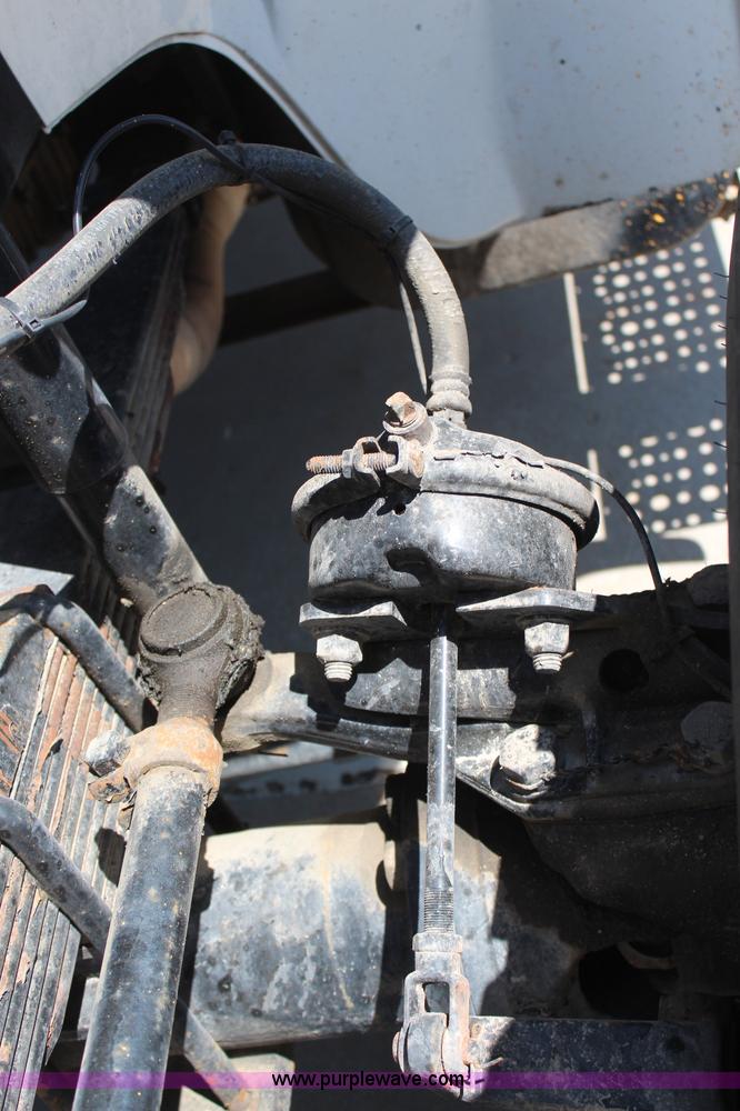 image for item H6088 2003 Freightliner FL80 flatbed truck with knuckle boom crane