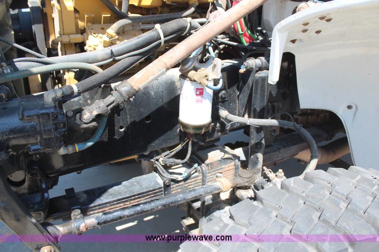 image for item H6088 2003 Freightliner FL80 flatbed truck with knuckle boom crane