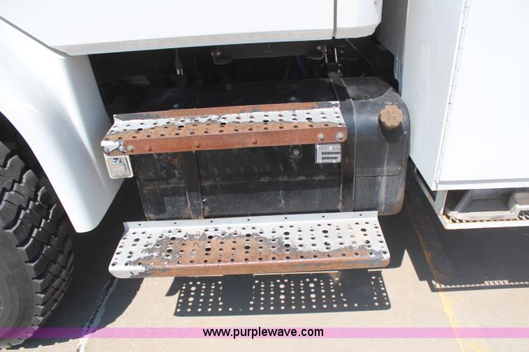 image for item H6088 2003 Freightliner FL80 flatbed truck with knuckle boom crane