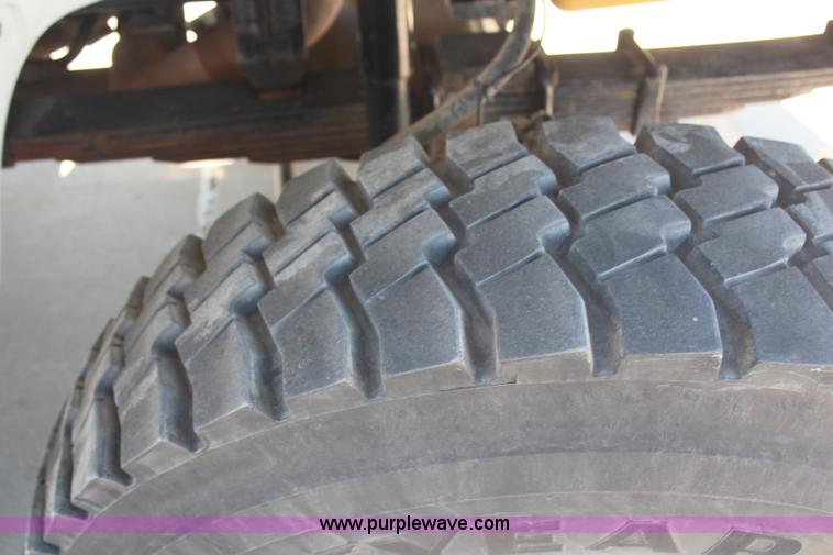 image for item H6088 2003 Freightliner FL80 flatbed truck with knuckle boom crane