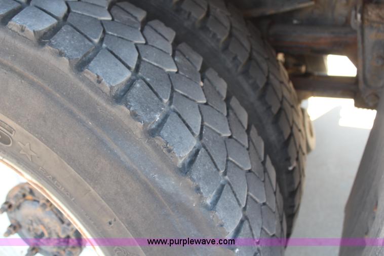 image for item H6088 2003 Freightliner FL80 flatbed truck with knuckle boom crane