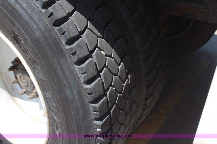 image for item H6088 2003 Freightliner FL80 flatbed truck with knuckle boom crane