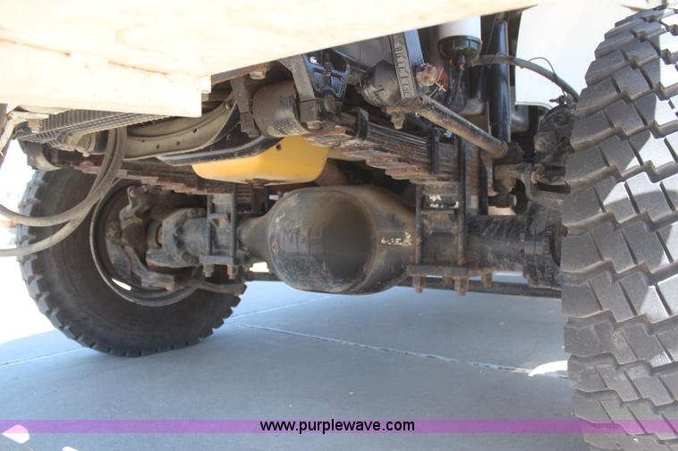 image for item H6088 2003 Freightliner FL80 flatbed truck with knuckle boom crane