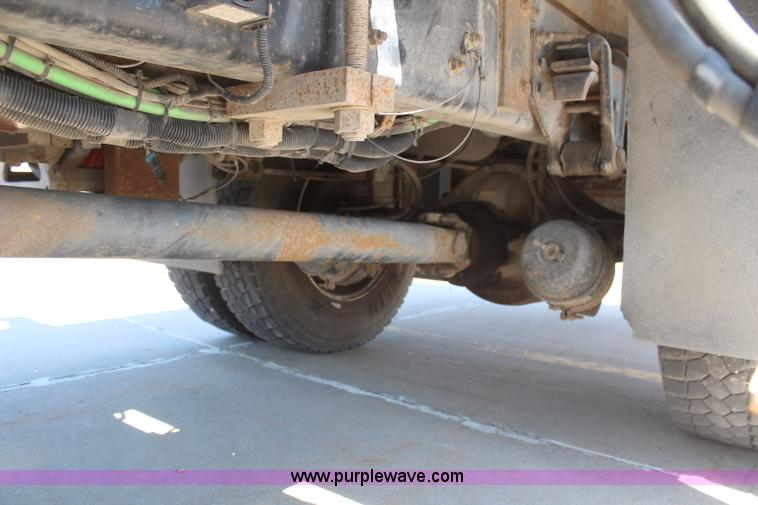 image for item H6088 2003 Freightliner FL80 flatbed truck with knuckle boom crane