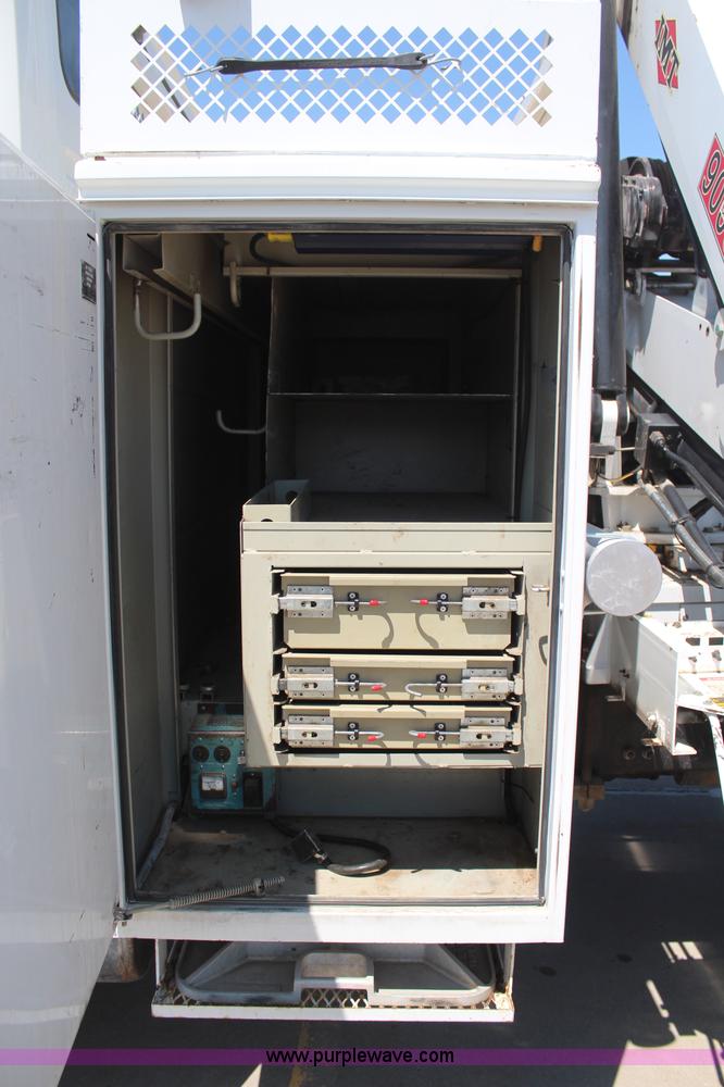 image for item H6088 2003 Freightliner FL80 flatbed truck with knuckle boom crane