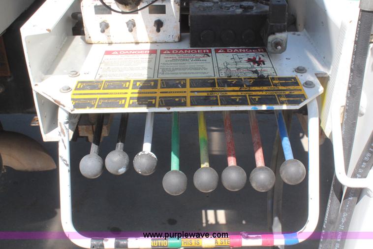 image for item H6088 2003 Freightliner FL80 flatbed truck with knuckle boom crane