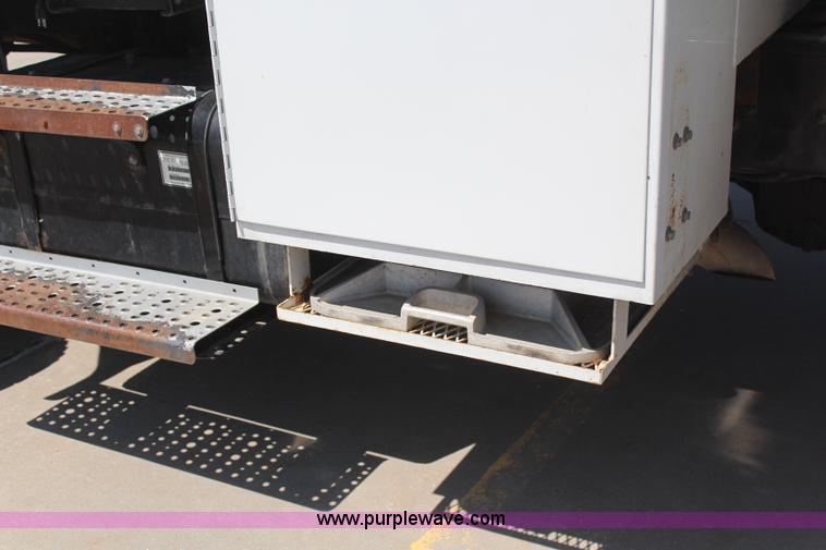 image for item H6088 2003 Freightliner FL80 flatbed truck with knuckle boom crane