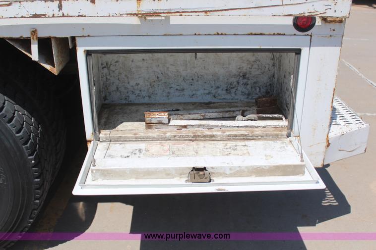 image for item H6088 2003 Freightliner FL80 flatbed truck with knuckle boom crane