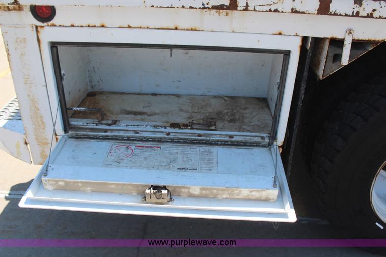 image for item H6088 2003 Freightliner FL80 flatbed truck with knuckle boom crane