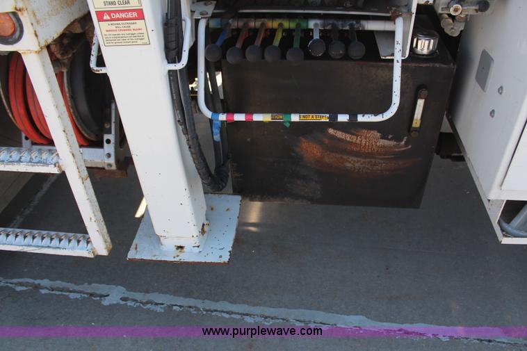 image for item H6088 2003 Freightliner FL80 flatbed truck with knuckle boom crane