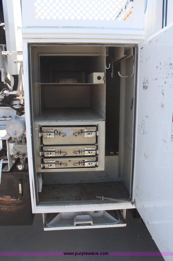 image for item H6088 2003 Freightliner FL80 flatbed truck with knuckle boom crane