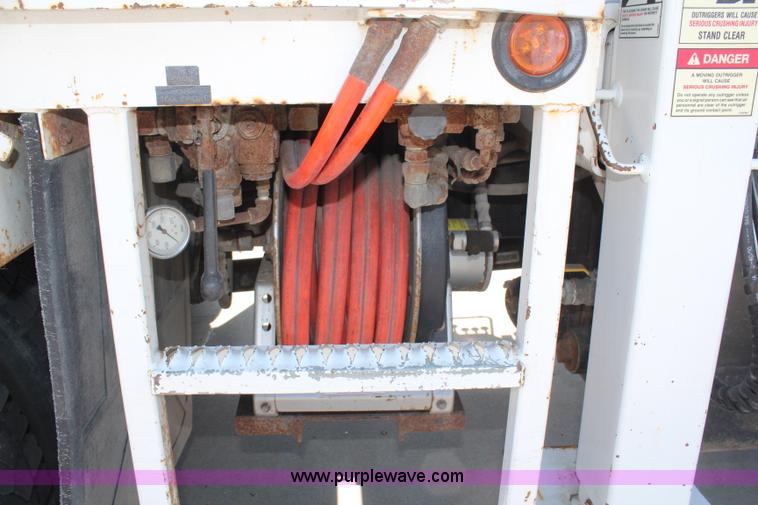 image for item H6088 2003 Freightliner FL80 flatbed truck with knuckle boom crane