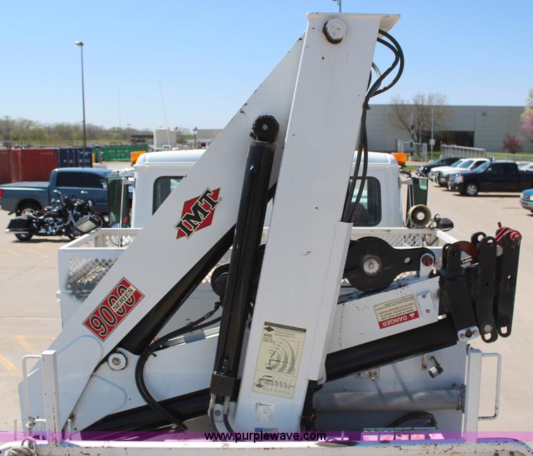 image for item H6088 2003 Freightliner FL80 flatbed truck with knuckle boom crane