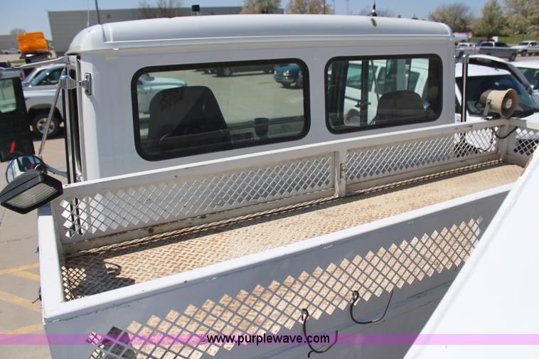 image for item H6088 2003 Freightliner FL80 flatbed truck with knuckle boom crane