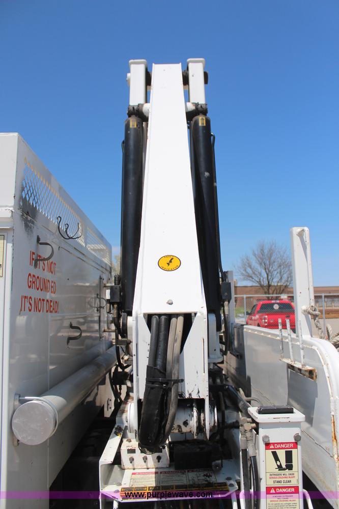 image for item H6088 2003 Freightliner FL80 flatbed truck with knuckle boom crane