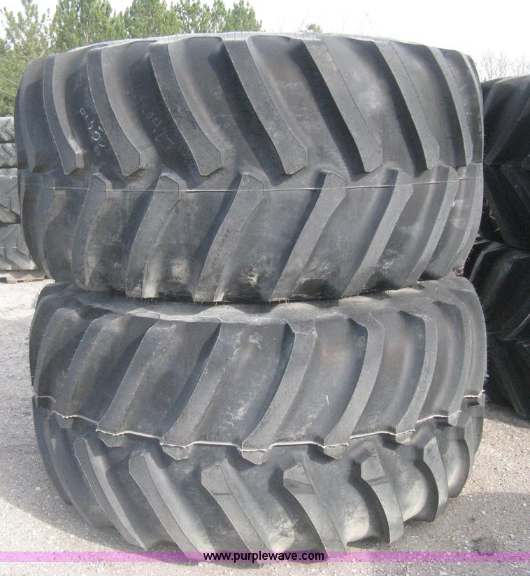 image for item AX9818 (2) aged Firestone 900/60R32 tire and wheel assemblies