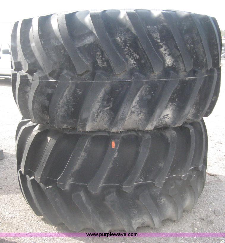 image for item AX9818 (2) aged Firestone 900/60R32 tire and wheel assemblies