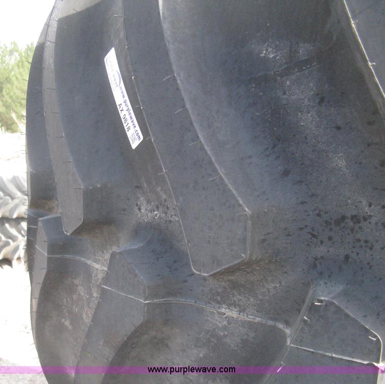 image for item AX9818 (2) aged Firestone 900/60R32 tire and wheel assemblies