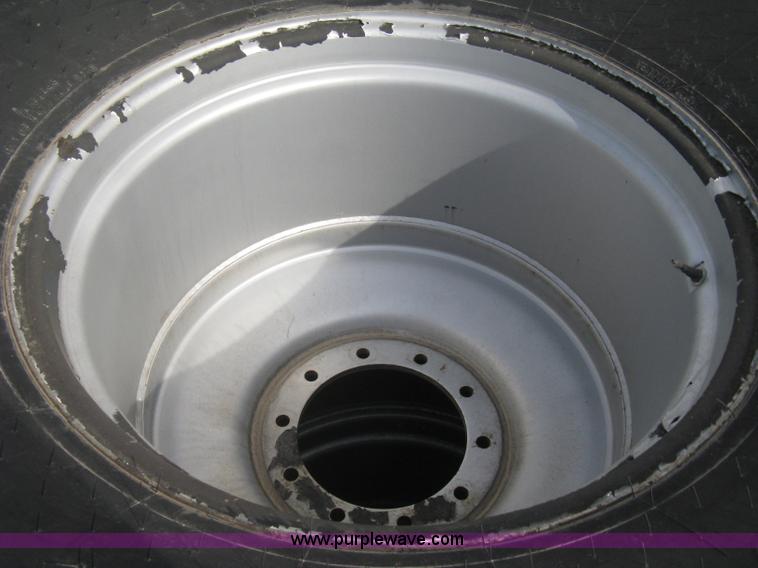 image for item AX9818 (2) aged Firestone 900/60R32 tire and wheel assemblies