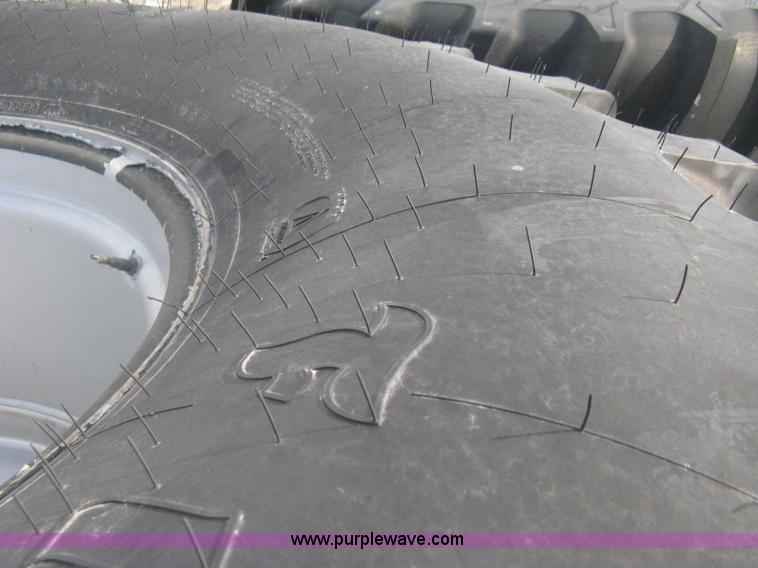 image for item AX9818 (2) aged Firestone 900/60R32 tire and wheel assemblies