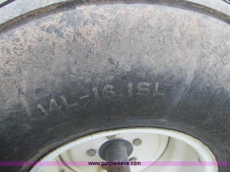 image for item I7032 2003 Hesston 8550S swather