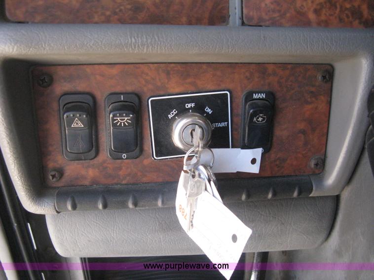 image for item G8281 2005 Kenworth T800 semi truck with knuckle boom crane and winch