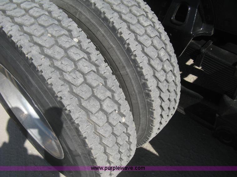 image for item G8281 2005 Kenworth T800 semi truck with knuckle boom crane and winch