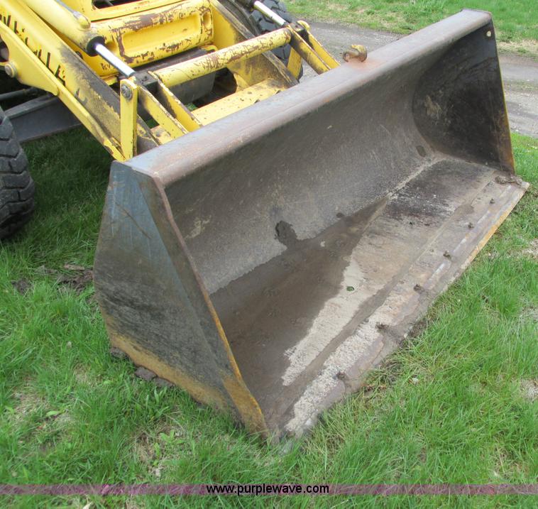 image for item E4713 2000 New Holland 575E backhoe