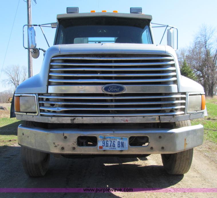 image for item E4718 1993 Ford LTL9000 tri axle semi truck