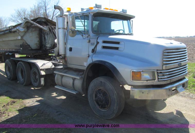 image for item E4718 1993 Ford LTL9000 tri axle semi truck