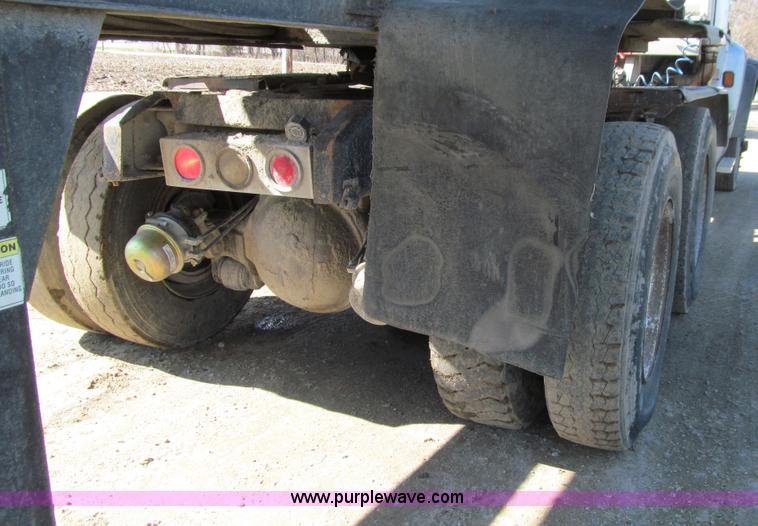 image for item E4718 1993 Ford LTL9000 tri axle semi truck