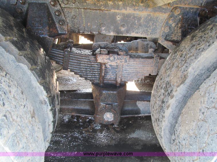 image for item E4718 1993 Ford LTL9000 tri axle semi truck