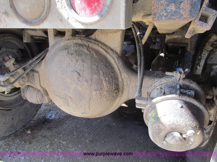 image for item E4718 1993 Ford LTL9000 tri axle semi truck