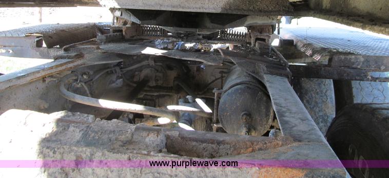 image for item E4718 1993 Ford LTL9000 tri axle semi truck