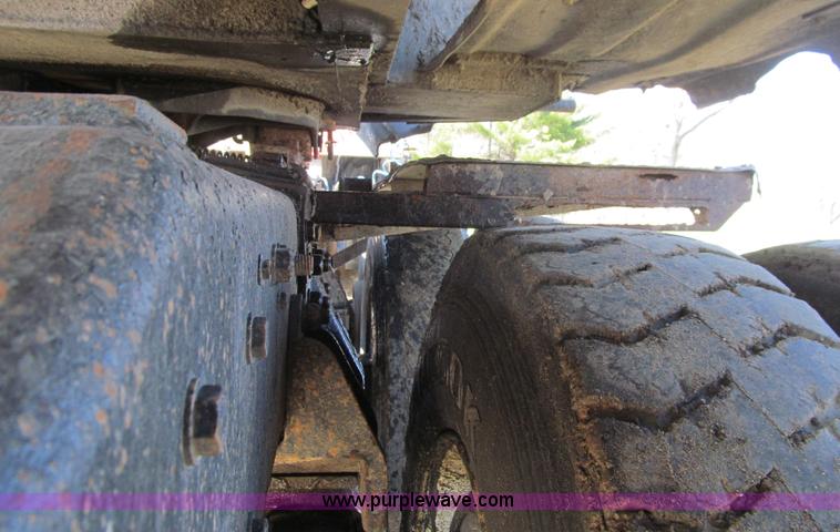 image for item E4718 1993 Ford LTL9000 tri axle semi truck
