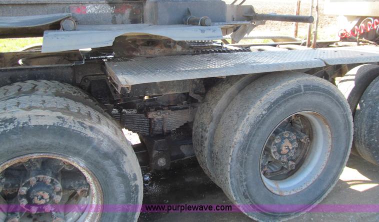 image for item E4718 1993 Ford LTL9000 tri axle semi truck