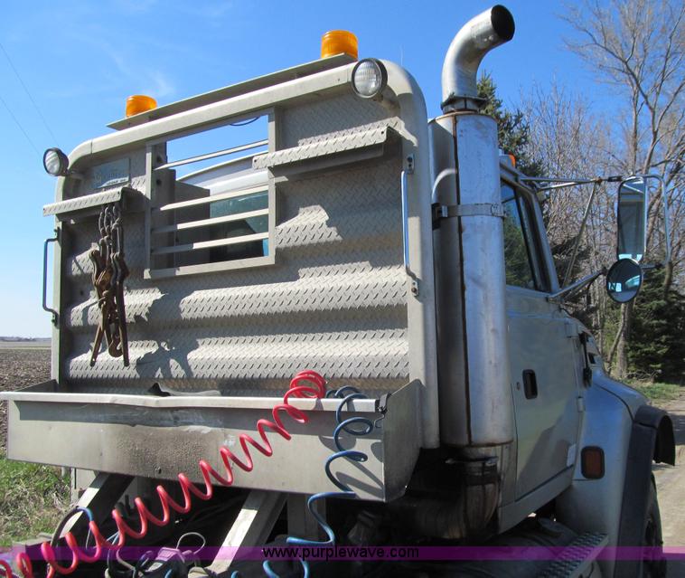 image for item E4718 1993 Ford LTL9000 tri axle semi truck