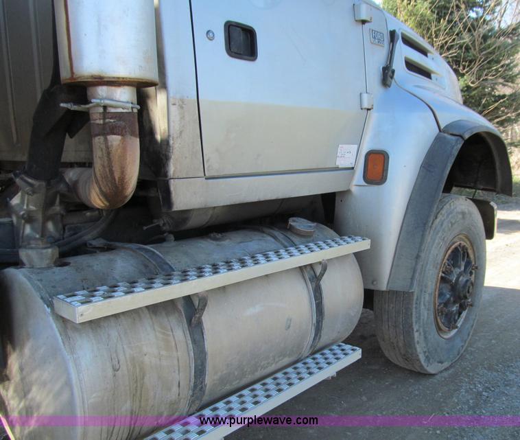 image for item E4718 1993 Ford LTL9000 tri axle semi truck