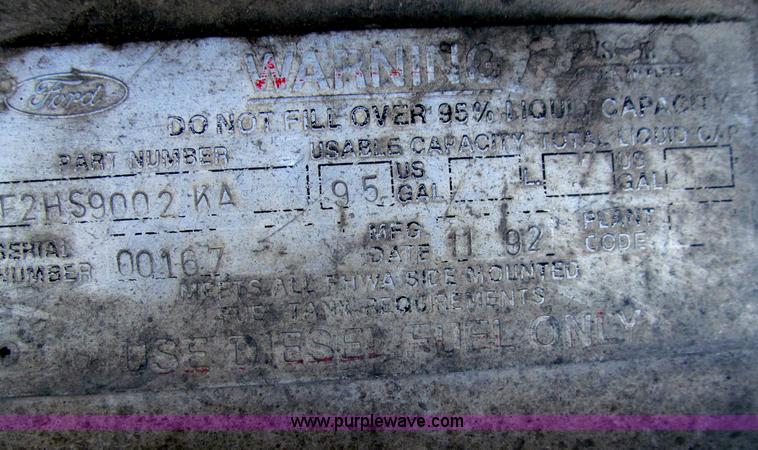 image for item E4718 1993 Ford LTL9000 tri axle semi truck