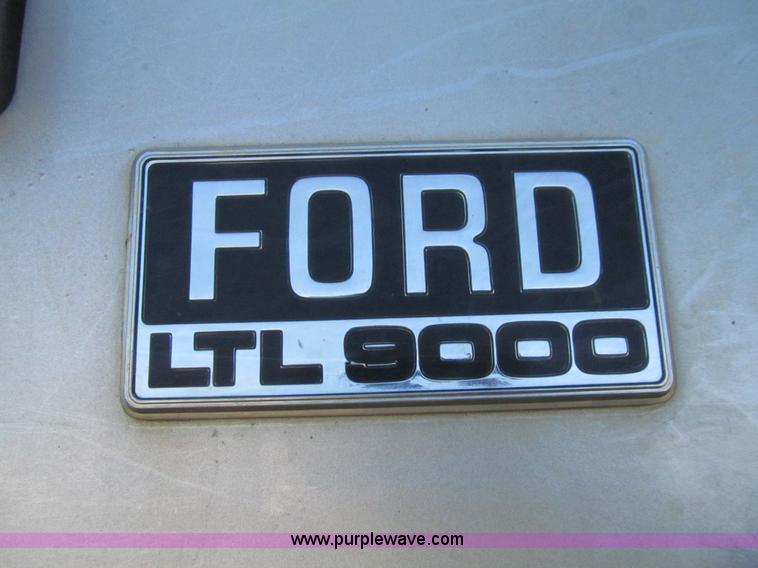 image for item E4718 1993 Ford LTL9000 tri axle semi truck