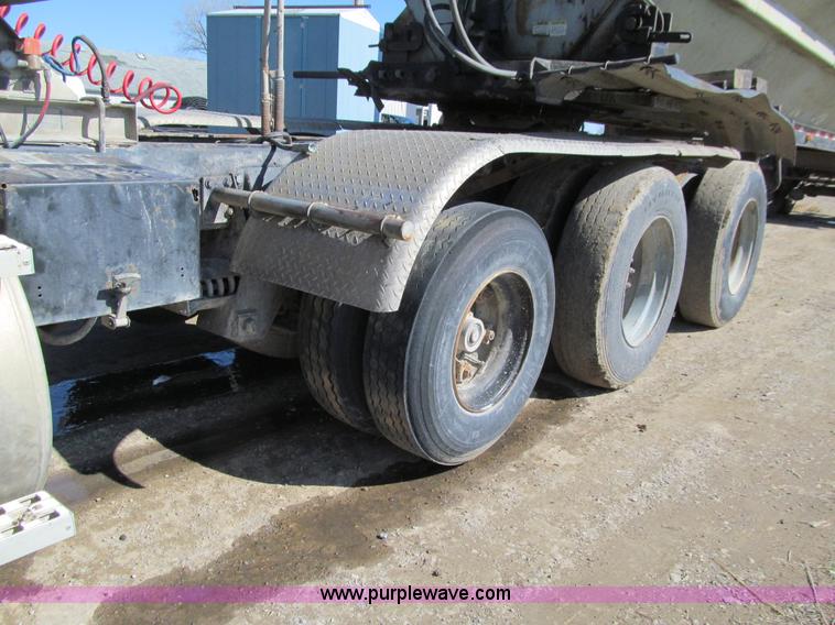 image for item E4718 1993 Ford LTL9000 tri axle semi truck