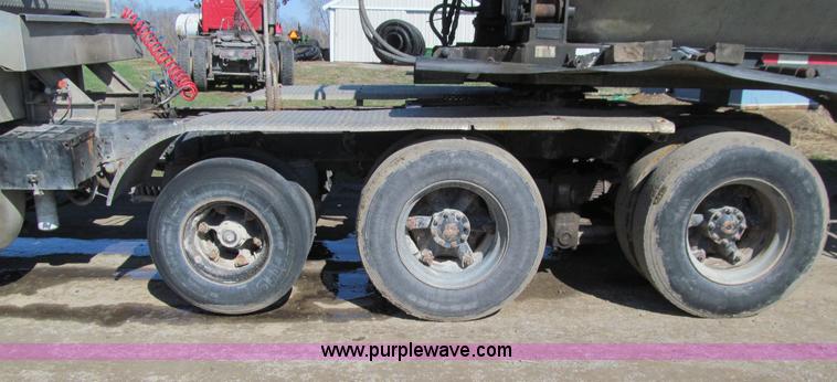 image for item E4718 1993 Ford LTL9000 tri axle semi truck