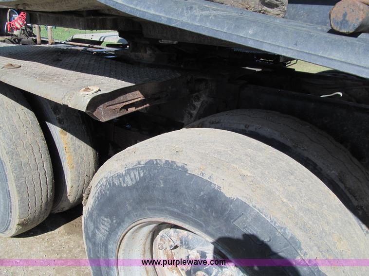 image for item E4718 1993 Ford LTL9000 tri axle semi truck