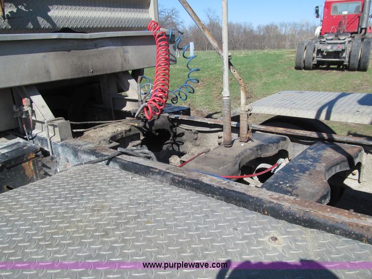 image for item E4718 1993 Ford LTL9000 tri axle semi truck