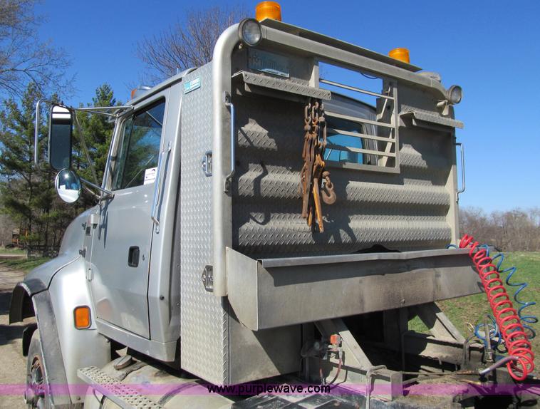 image for item E4718 1993 Ford LTL9000 tri axle semi truck