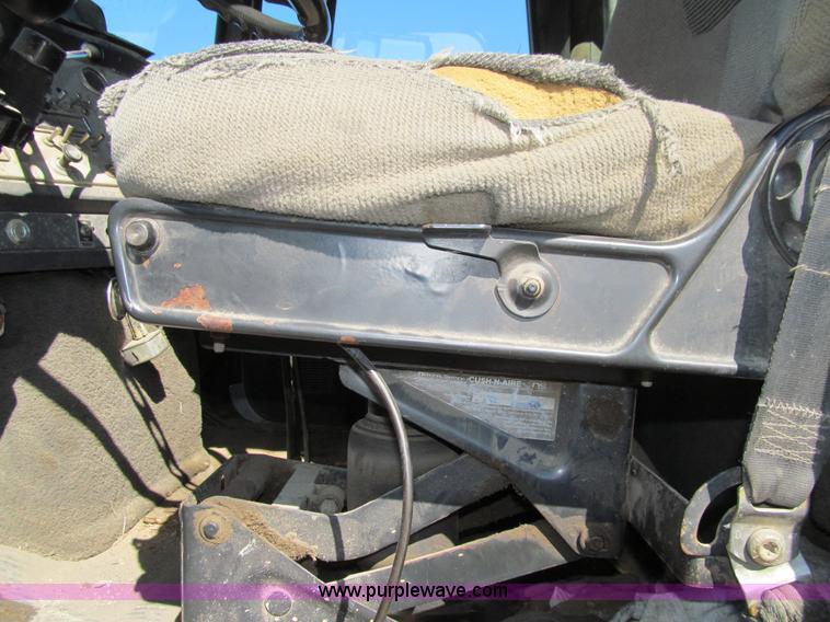 image for item E4718 1993 Ford LTL9000 tri axle semi truck