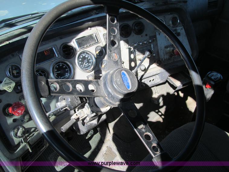 image for item E4718 1993 Ford LTL9000 tri axle semi truck
