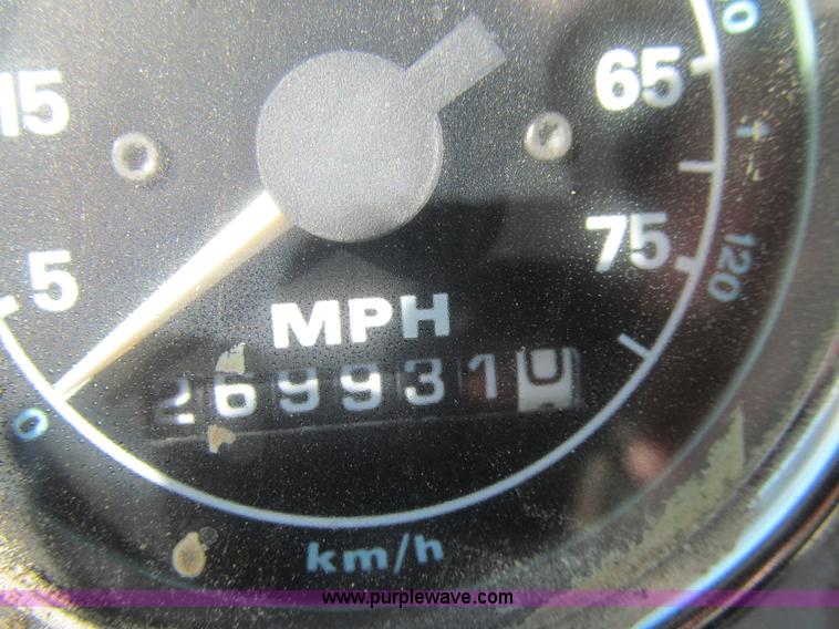 image for item E4718 1993 Ford LTL9000 tri axle semi truck