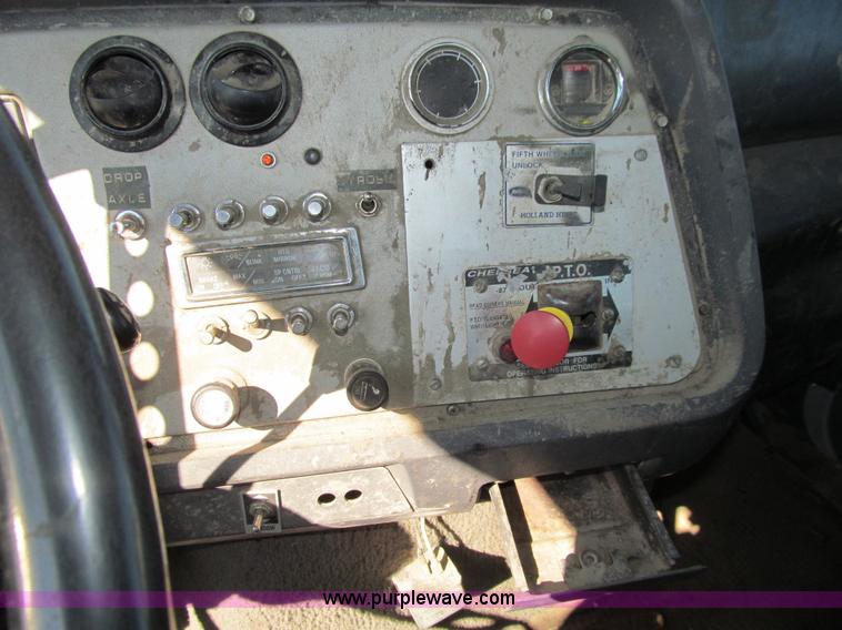 image for item E4718 1993 Ford LTL9000 tri axle semi truck