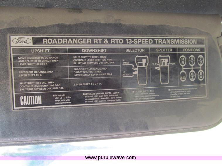 image for item E4718 1993 Ford LTL9000 tri axle semi truck